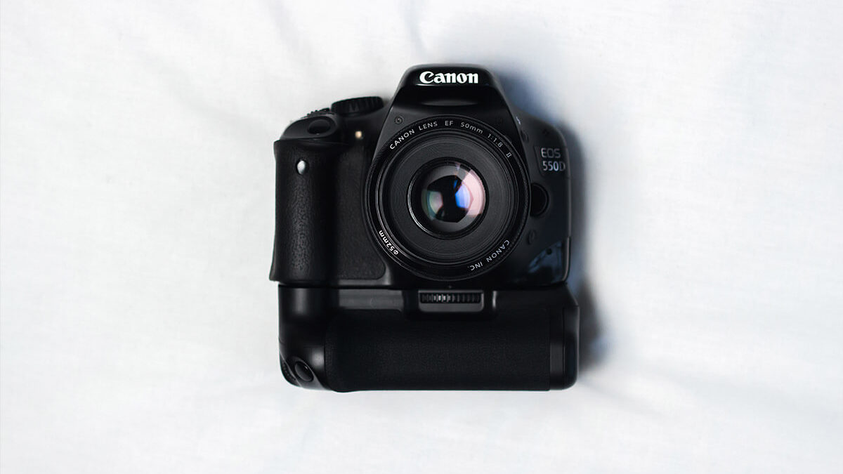 Nothing Can Beat Black Camera On White Silky Cloth